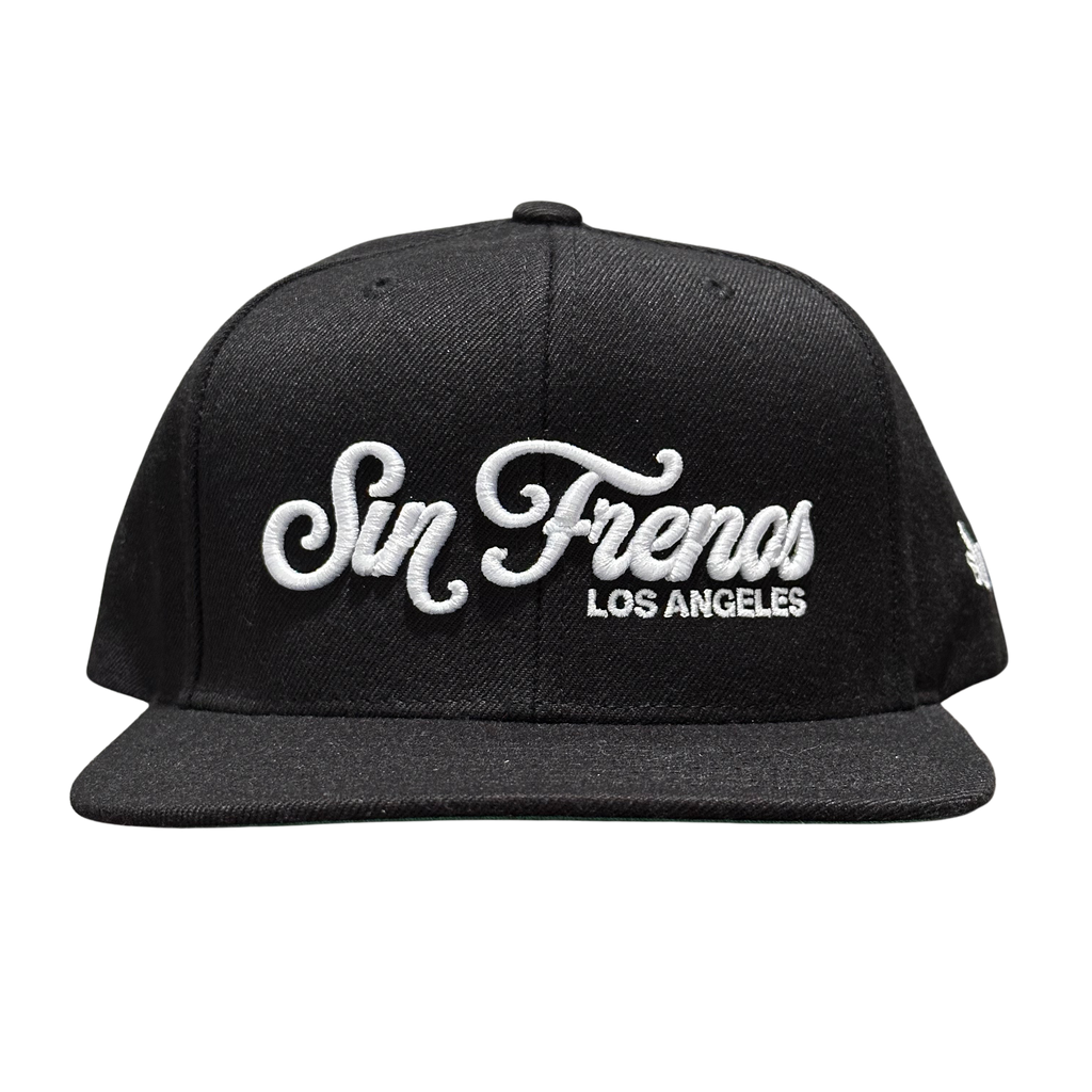 Sin Frenos Script Snapback cap in black.