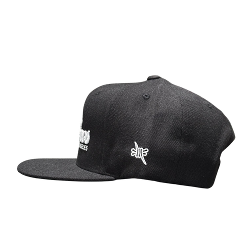Sin Frenos Script Snapback cap in black.