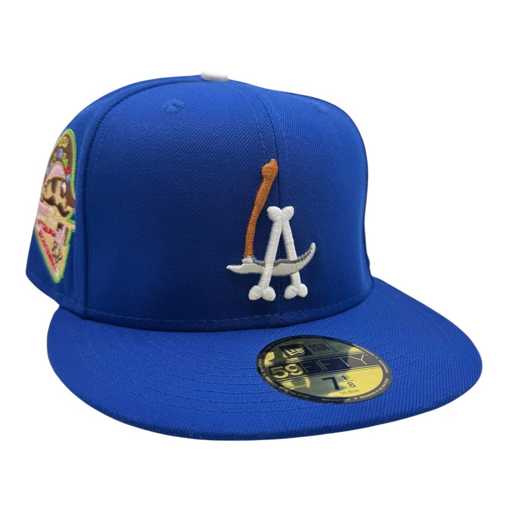 Blue baseball cap with logo and patch on a white background
