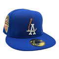 Blue baseball cap with logo and patch on a white background