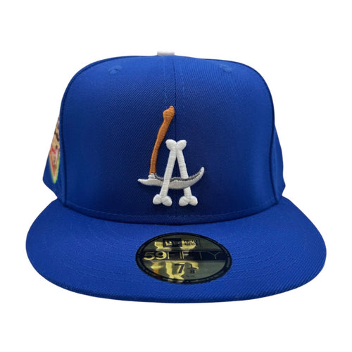 Blue baseball cap with logo and New Era patch on a white background